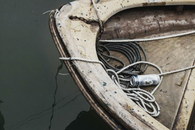 Boat tied to dock